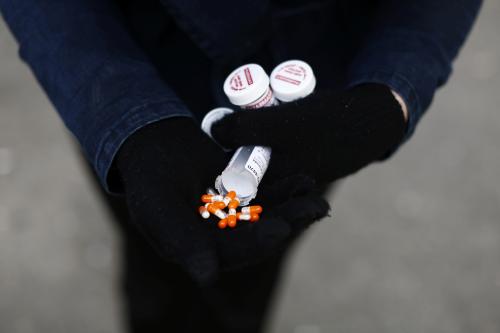 A fentanyl user displays a "safe supply" of opioid alternatives, including morphine pills, provided by the local health unit to combat overdoses due to poisonous additives and to support addicts and the homeless into practicing social distancing to help slow the spread of coronavirus disease (COVID-19) in the Downtown Eastside of Vancouver, British Columbia, Canada April 6, 2020. Picture taken April 6, 2020. REUTERS/Jesse Winter