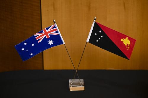 An Australian flag and the flag of Papua New Guinea are seen at the Australia-Papua New Guinea Ministerial Forum at Parliament House in Canberra, Friday, February 17, 2023.